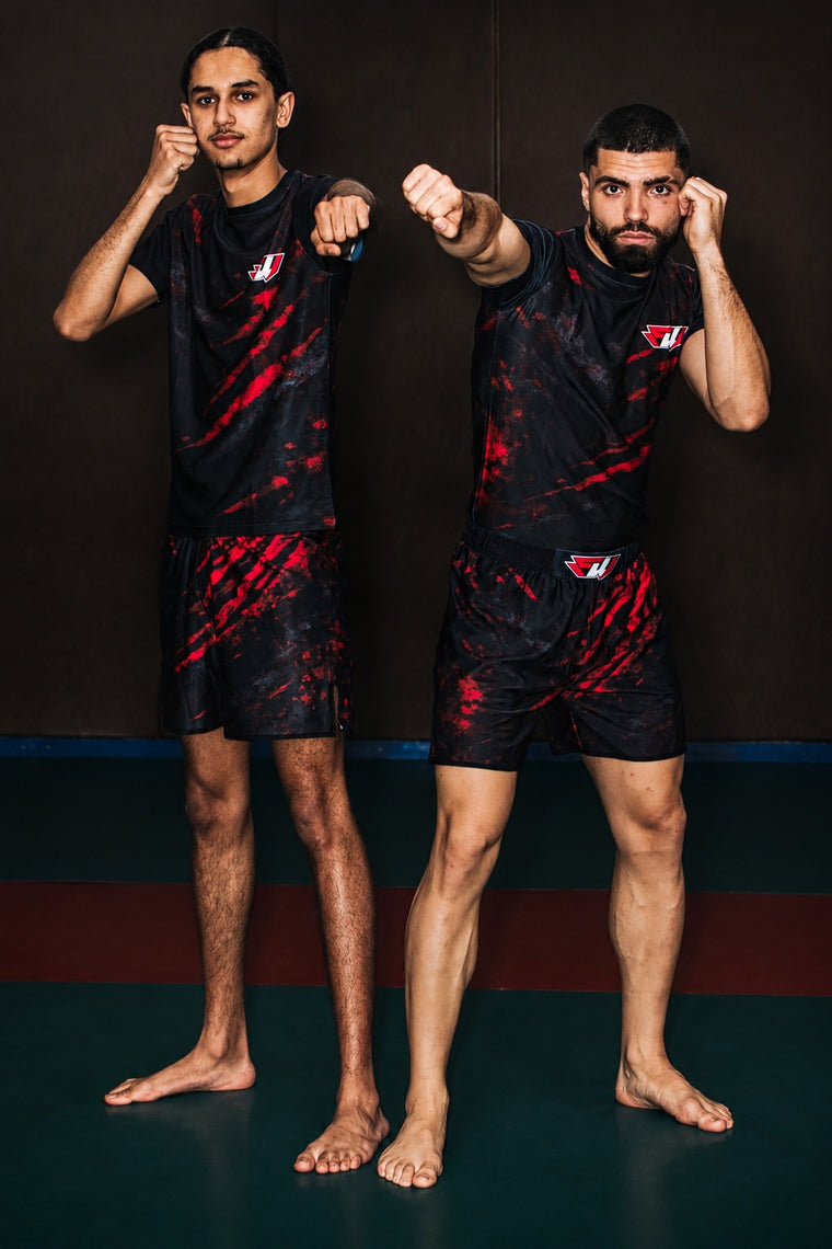 Combattants FightWatch en tenue fightwear pour boxe MMA et kickboxing